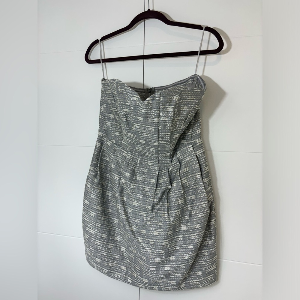 Silver/grey strapless Greylin party dress with pockets.